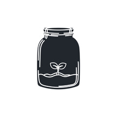 A small green sprout growing inside a glass jar. Symbolizes indoor gardening, new life, growth, and sustainable ecosystems.