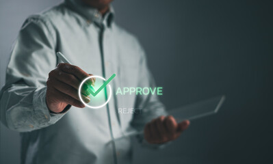 Businessman uses pen to check box, shows completed online survey or checklist and approve digital document with virtual screen. Assessment and document management concept