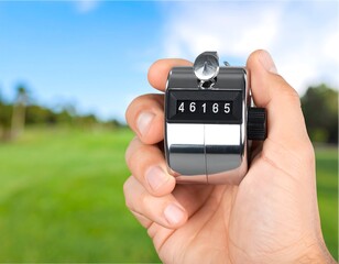 Hand holding a golf counter (2)