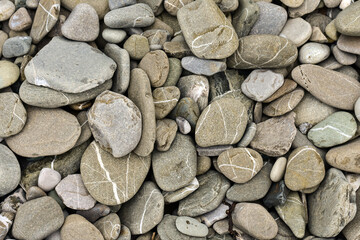 Stone texture. Natural abstract backgrpund. A lot of sea round pebbles.Stone beach smooth. Background with round pebbles stones.