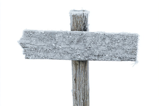a wooden sign with a snow covered top