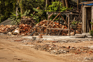 Building Materials on Poor Quality Rural Road Near Wenchang City, Hainan, China