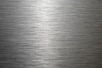 Shiny brushed metal texture background with a horizontal line pattern and a polished surface for industrial and decorative design element