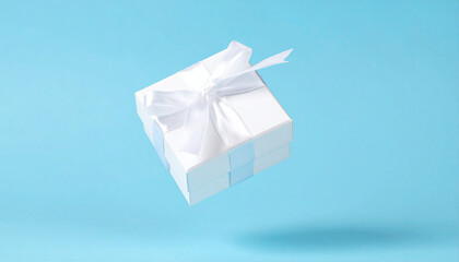 Small white gift box with bow floating over blue background. Minimal present.