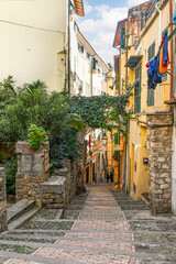 A typical uphill alley in the medieval district called "La Pigna" (the pine cone) for the characteristic shape of its streets and fortifications, Sanremo (Imperia), Liguria, Italy