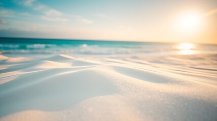 Sunlit sand dunes meet turquoise ocean waves beach