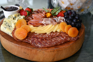 catering buffet food, banquet table with snacks,  savory breadsticks with rosemary garnish, elegant appetizer crackers in glass bowl, catering display of gourmet snacks