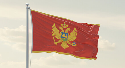 The Montenegrin national flag waving softly in the early morning breeze, set against a pale, cloudless sky.