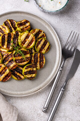 Grilled zucchini with garlic sauce