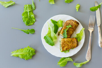 Breakfast with omelette, salad and fresh green herbs