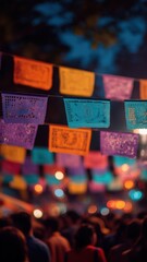 Colorful festive papel picado banners at night celebration in a vibrant outdoor festival