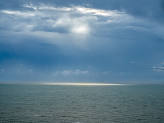 Seascape with strong wind and wave under cloudy sky in evening