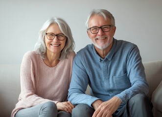 A Joyful Couple is Smiling Together on a Couch in Their Cozy Living Room Filled with Comfort and Love