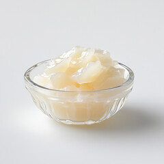 A small glass bowl of transparent coco jelly