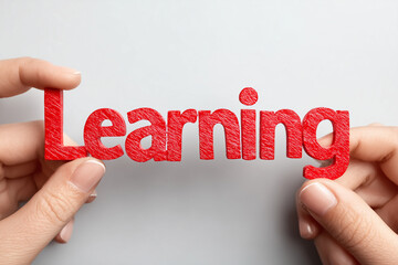 3D text Learning" in red color two hands holding