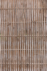 Woven brown bamboo wood stick mat texture striped pattern surface natural wall covering