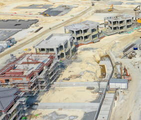 Aerial view of a construction site with buildings rising amidst the sandy landscape, hinting at urban development and architectural progress, Ä°stanbul, Ä°stanbul, TÃ¼rkiye.