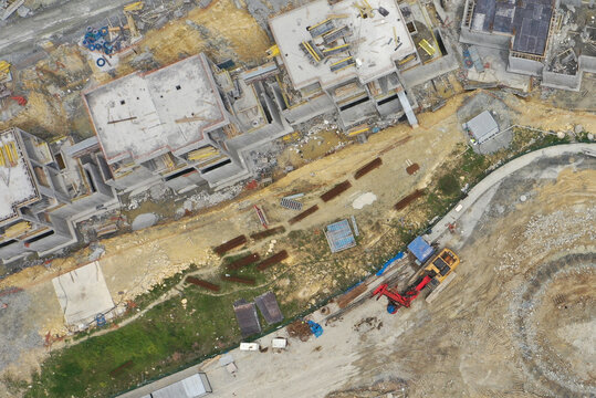 Aerial view of construction site with buildings in progress and heavy machinery, contrasting with the surrounding landscape, &Auml;&deg;stanbul, &Auml;&deg;stanbul, T&Atilde;&frac14;rkiye.