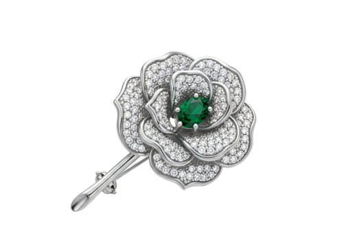 Detailed view of a diamond and emerald flower brooch.