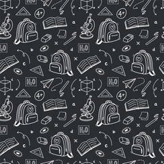 Pattern school supplies on black background. School background. Back to school. Blackboard with Drawings of School Supplies. Seamless pattern with doodles. Abstract blackboard. Education concept