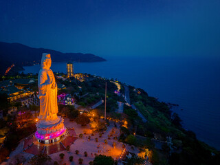 Night view of lady buddha statue overlooking Da nang coastline