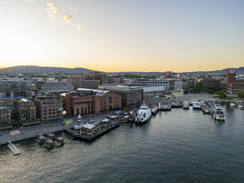 Aerial view of the vibrant Aker Brygge waterfront, with its modern architecture meeting the serene waters of Oslofjord, Oslo, Norway.