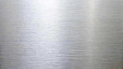 A close up of brushed metal texture with subtle light reflections, ideal for backgrounds in industrial design and modern technology projects