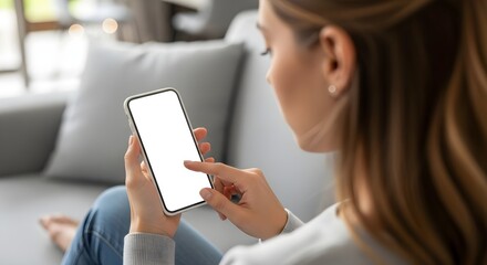 Woman using smartphone with blank screen while relaxing on couch in comfortable home setting inside of house on transparent background