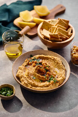 Delicious hummus with olive oil, chickpeas and parsley