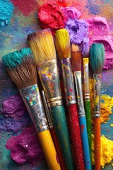 Obraz premium Colorful paintbrushes on a vibrant palette (1)