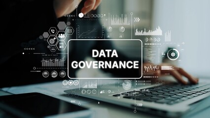 Business professional analyzing data governance with digital graphs and technology elements in modern office setting. Asymptotic smart data analytic.