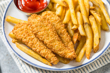 Deep Fried Tender Chicken Fingers and French Fries