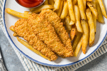 Deep Fried Tender Chicken Fingers and French Fries