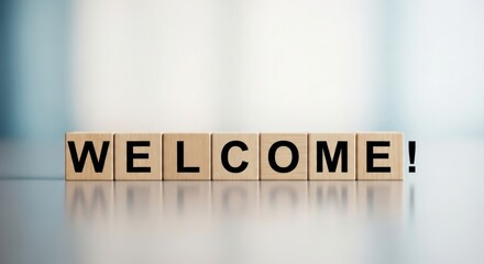 Wooden blocks spelling out the word welcome, signifying a warm greeting and positive introduction