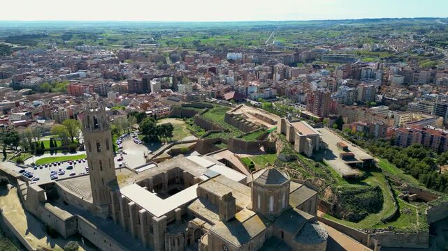 Aerial view of the Seu Vella cathedral, a historic landmark with its old stone architecture standing out against the modern city, Lleida, Spain.