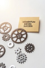 Momentum for Success with Gears on a Desk Background