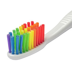 Close-up of a toothbrush head with vibrant rainbow colored bristles