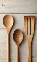 Wooden kitchen utensils on a light wooden surface cooking