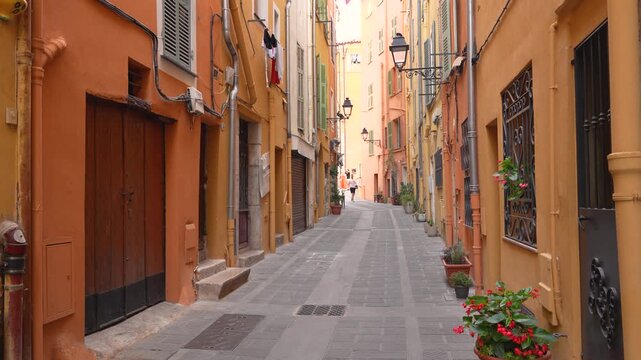 Menton, France - June 17, 2025: Menton France Charming Pastel Color City Street. European French Riviera Cote d'Azur Alleyway Travel