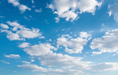 A blue sky with fluffy white clouds