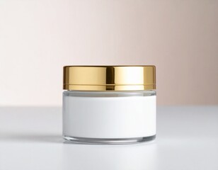 Close Up of Clear Glass Cosmetic Cream Jar with Golden Lid on White Surface