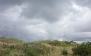 Cloudy sky over a beach hills