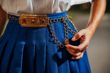 Ornate Belt and Vibrant Outfit Close-Up