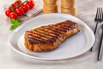 Grilled pork steak with bone