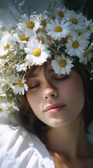 Beautiful young woman with closed eyes wearing a daisy flower crown. Summer concept. Natural beauty and relaxation.