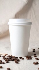White Paper Coffee Cup with Dark Roasted Beans on Beige Background Flat Lay