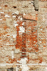 Old brick wall texture, weathered red bricks, rustic surface, exposed mortar, uneven brickwork, chipped and crumbling areas, historic building facade, vintage construction, urban decay aesthetic, arch