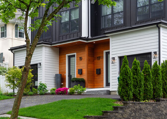 Beautiful facade of a modern duplex house on a spring day in Brighton, Massachusetts, USA

