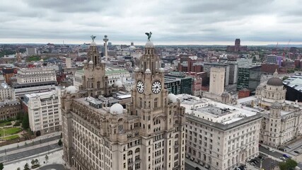 The Three Graces proudly stand on the world famous Liverpool waterfront making a striking skyline. - Powered by Adobe