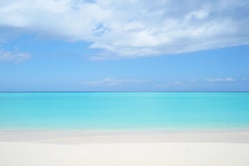 Serene tropical beach with turquoise water and cloudy sky